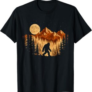 Bigfoot Moonlight Forest Silhouette T-Shirt featuring original artwork of Bigfoot walking beneath a full moon in a pine forest.